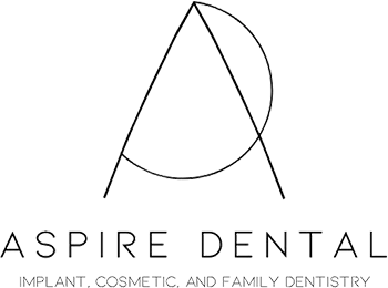 Aspire Dental logo featuring stylized tooth design with practice name and tagline below.